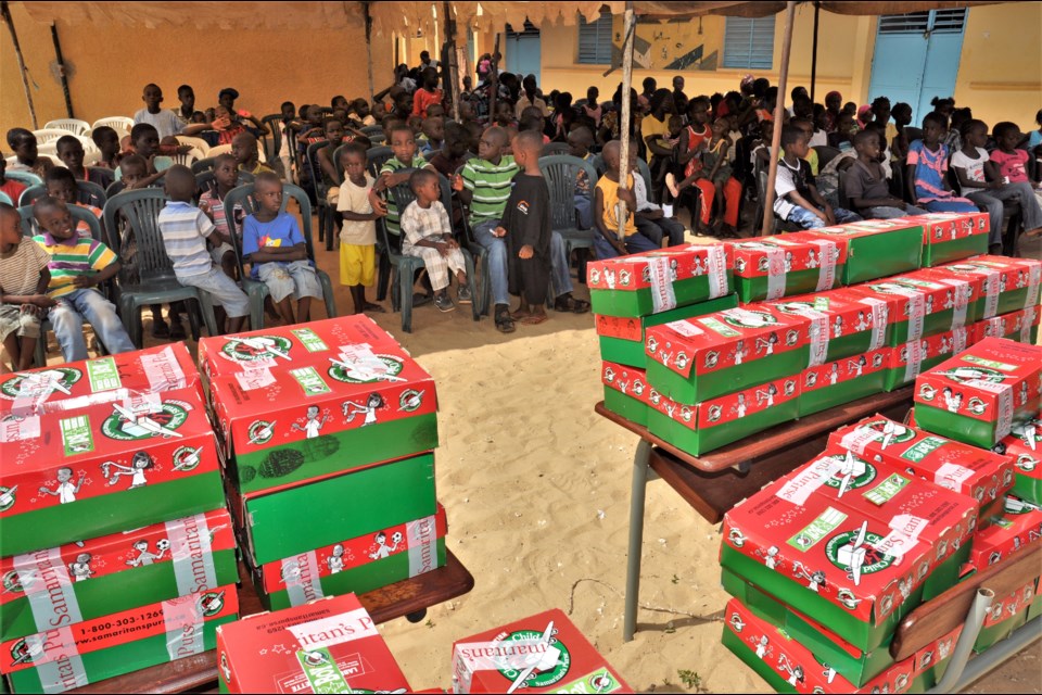 Children in a Senegal wait to receive their shoeboxes as part of Operation Christmas Child. Photo contributed