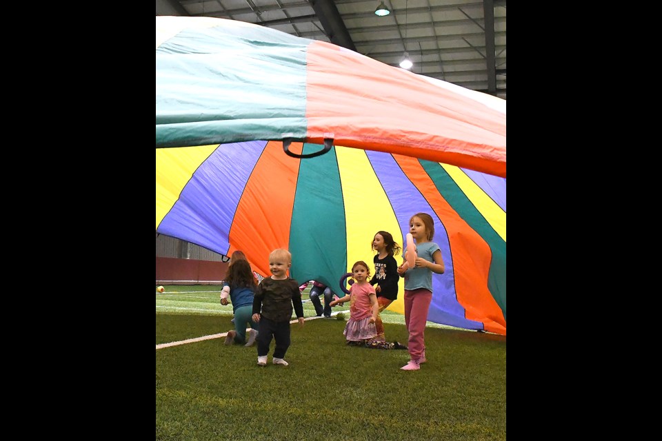The old staple of elementary school gyms everywhere, the parachute drew a crowd of little ones throughout the night.