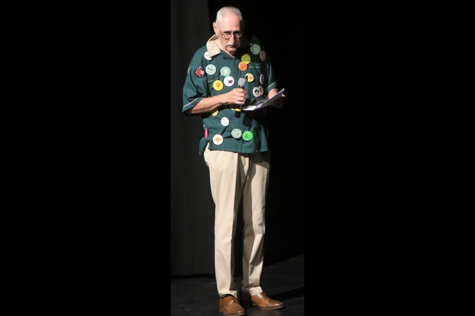 Retired drama teacher Lyle Johnson was the event MC. Covering his shirt are 60 buttons from the many drama performances he helped lead over the years. Photo by Jason G. Antonio