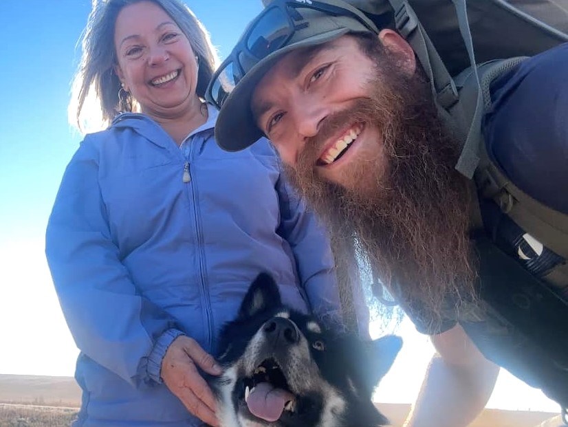Carol Kapay (left) greets Ryan (Bushman Art) Giesbrecht (right) and Nahko (centre) as they arrive in Moose Jaw this November.
