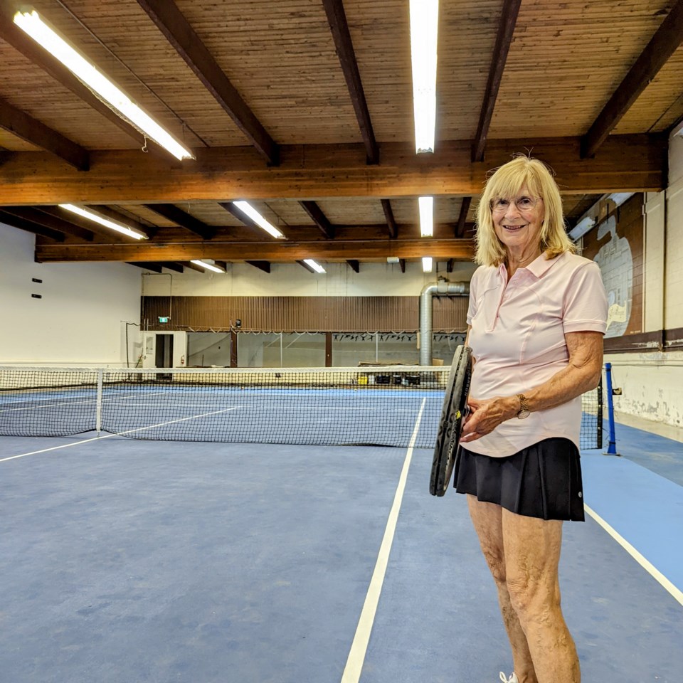 Resident Joan Buckmaster teaches tennis around the city. Here she is at the indoor tennis court in the Golden Ticket Sports Centre