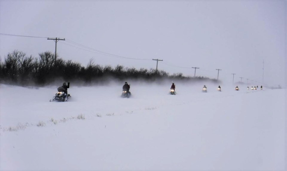 prairie women on snowmobiles