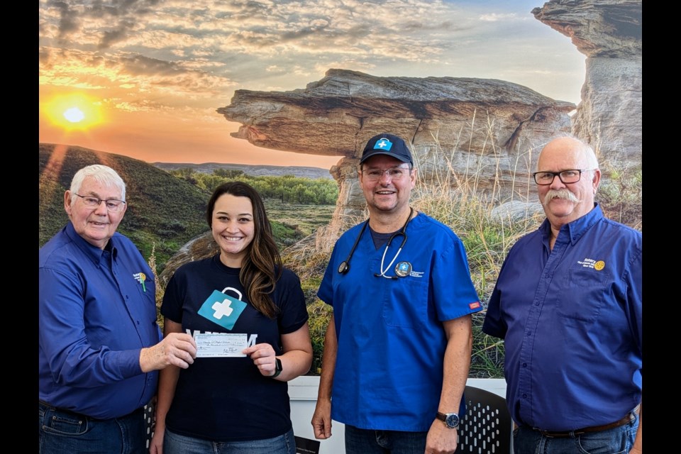 Rotary Club of Moose Jaw members present a cheque for $10,000 to the Moose Jaw International Medical Mission:
(l-r) Glen Blager, Maggie Metke, Mark Brown, and Garth Palmer