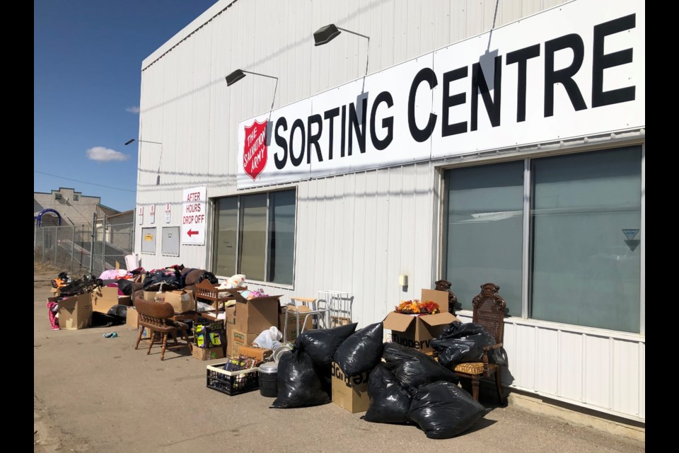 A pile of donations built up outside the Salvation Army sorting centre over the Easter long weekend. Most items had to be thrown out because they were considered junk. Photo by Jason G. Antonio 