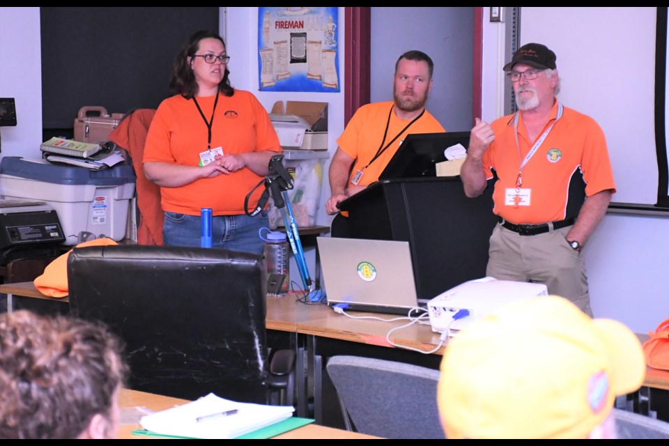 A small group of residents listens to team members of Moose Jaw Search and Rescue discuss what the organization does and the important role it plays in the community, during an information night on Oct. 3. Photo by Jason G. Antonio