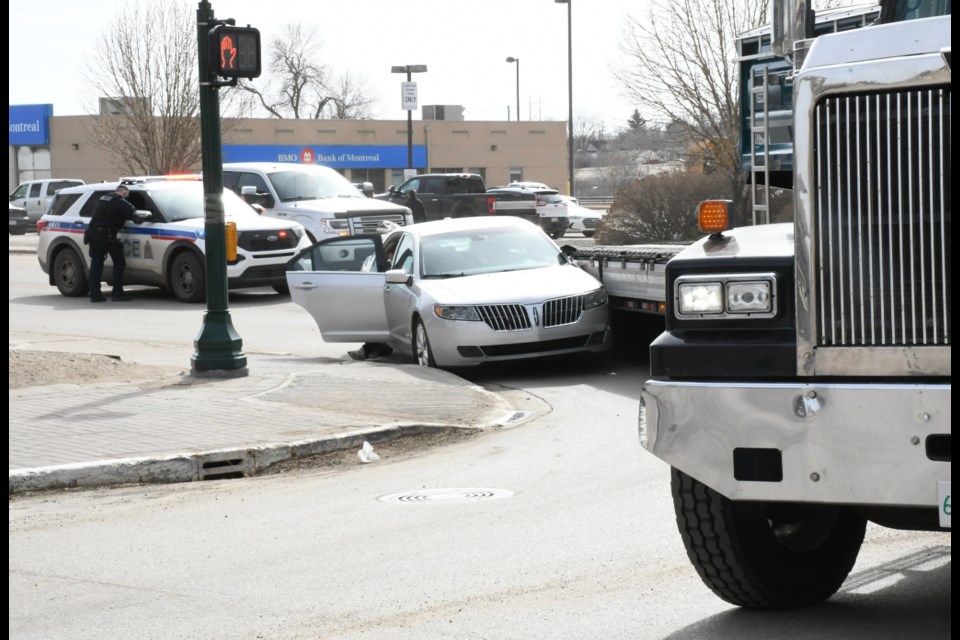 No one was injured after a semi-truck and a Lincoln MKZ were involved in a collision in downtown Moose Jaw around 11:20 a.m. on April 1. Photo by Jason G. Antonio 