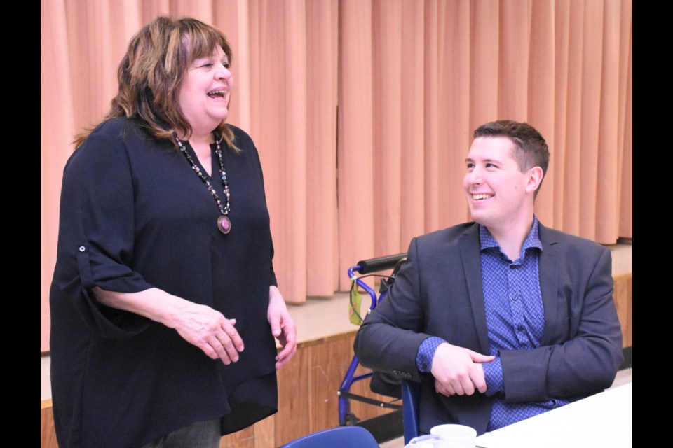 Vicki Wadsworth, president of the Moose Jaw and District Seniors Association, shares a laugh with Talon Regent before the start of a banquet to thank volunteers. Photo by Jason G. Antonio