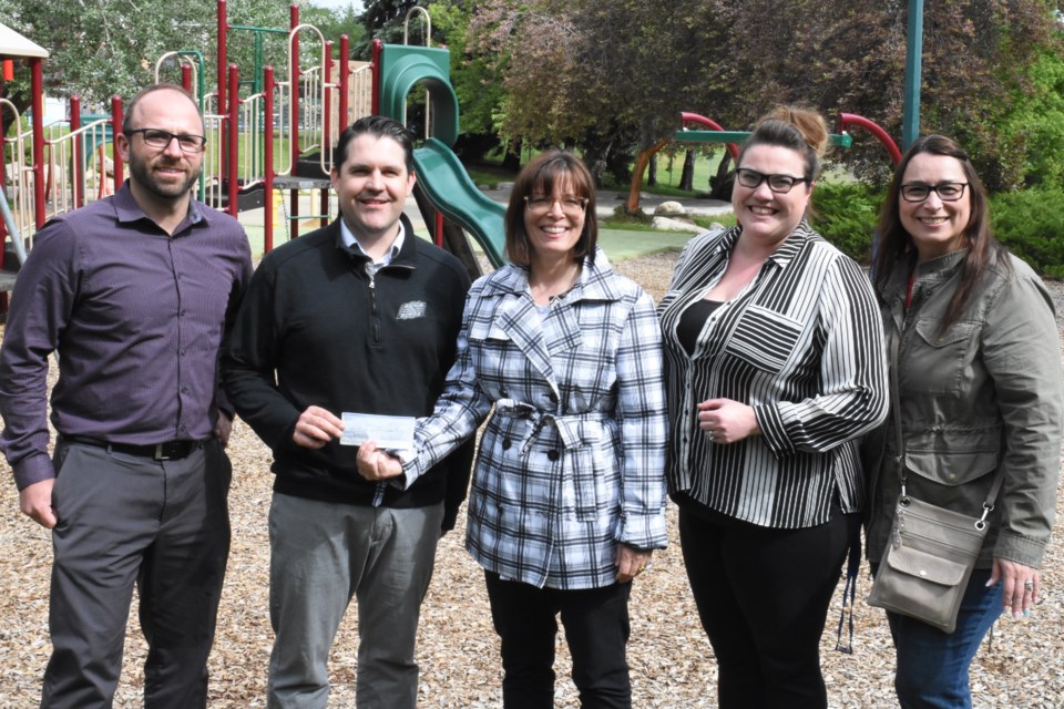 The committee for the 2018 Saskatchewan Senior Fitness Association 55-plus Provincial Summer Games presented a cheque worth $8,819.86 to the City of Moose Jaw’s parks and recreation department on June 20. The money will go to installing fitness equipment for seniors in Crescent Park adjacent to the spray pad. Pictured are Derek Blais, director of parks and recreation; Scott Osmachenko, recreation services manager; Crystal Froese, committee chair; and host committee members Amanda Kohl and Sandra Stewart. Photo by Jason G. Antonio 