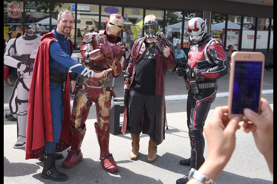 Sidewalk Days wouldn’t seem complete without the cadre of superheroes hanging around outside of Joe’s Place.