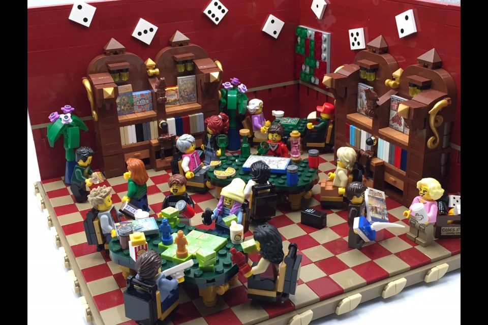 SLUG member Nicole Gent has used her extra time to finish this piece, depicting a bustling games room full of tiny Lego figures enjoying each other’s company while the real world avoids doing the same. (supplied by Nicole Gent)