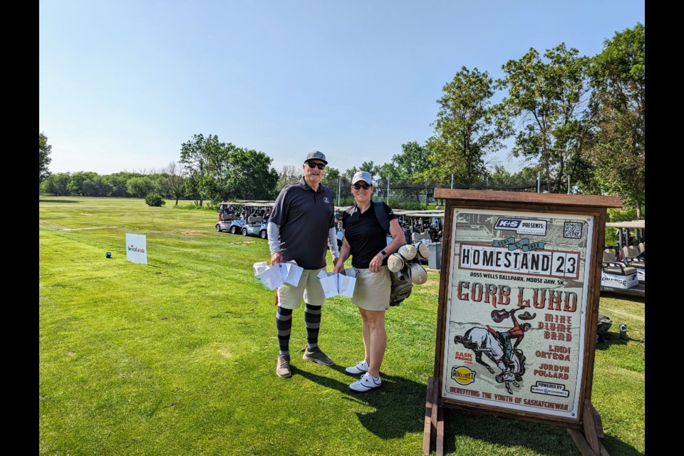 Clive Tolley and Maryse Carmichael, Moose Jaw's mayor and city manager, respectively, preparing to tee off