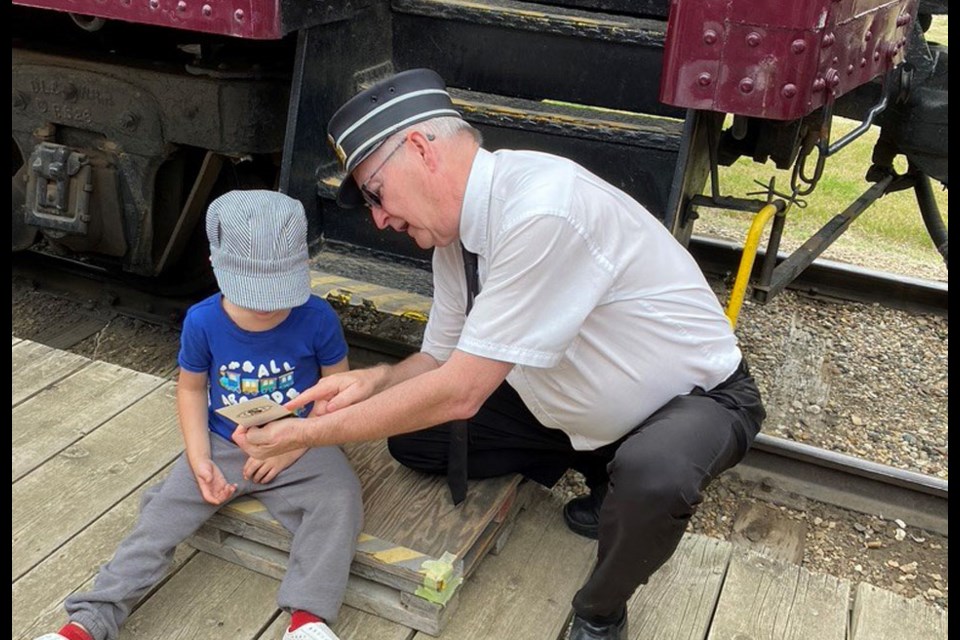 A youngster, about five years old, was concerned the conductor would rip his ticket in half.