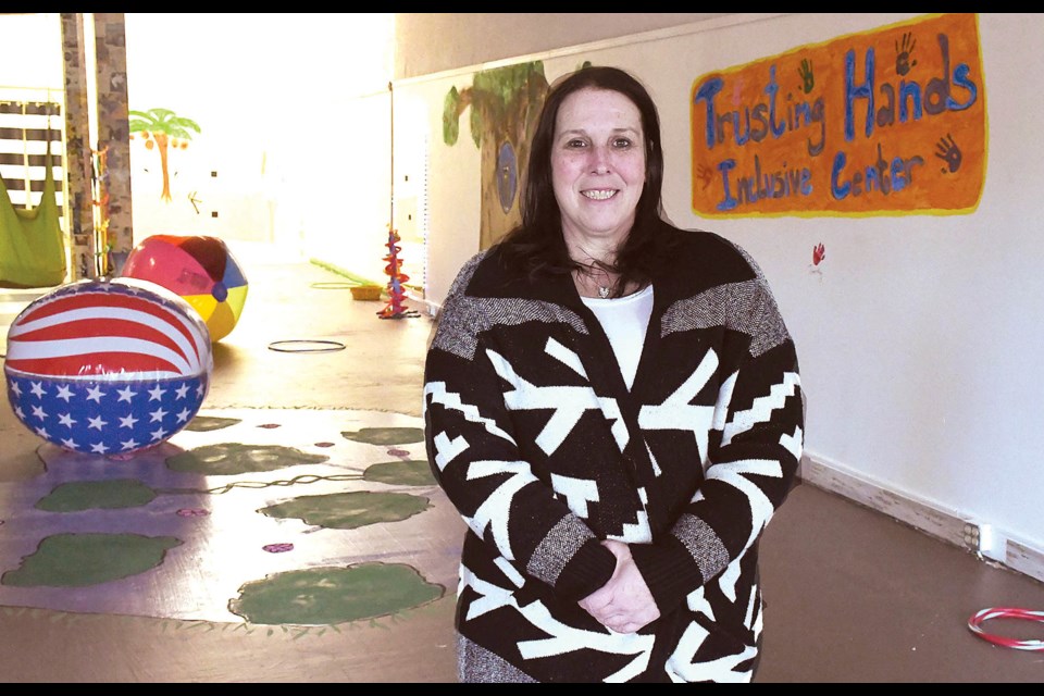 Susan Kellock, owner and consultant with Trusting Hands Inclusive Center shows off their new space in the former Rainbow Retro store.