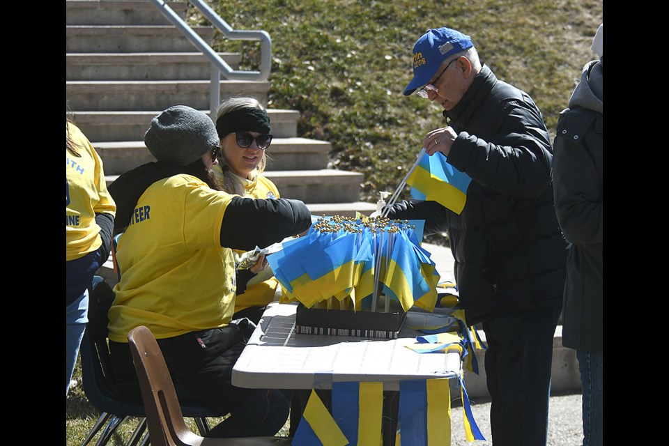 Volunteers were on hand selling Ukraine flags as a show of solidarity with the rally participants.