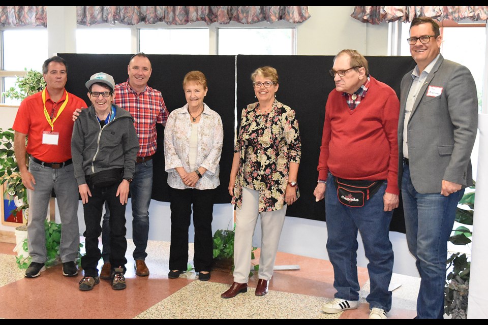 Valley View residents and management are joined by Moose Jaw mayor Fraser Tolmie and Minister of Social Services Paul Merriman during the cemetery monument dedication ceremony.