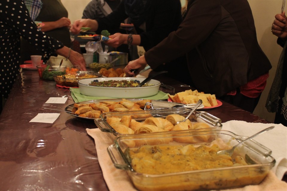 The food at this year’s International Women’s Society potluck supper was an impressive and delicious display, with each dish brought by an attendee of the event. 