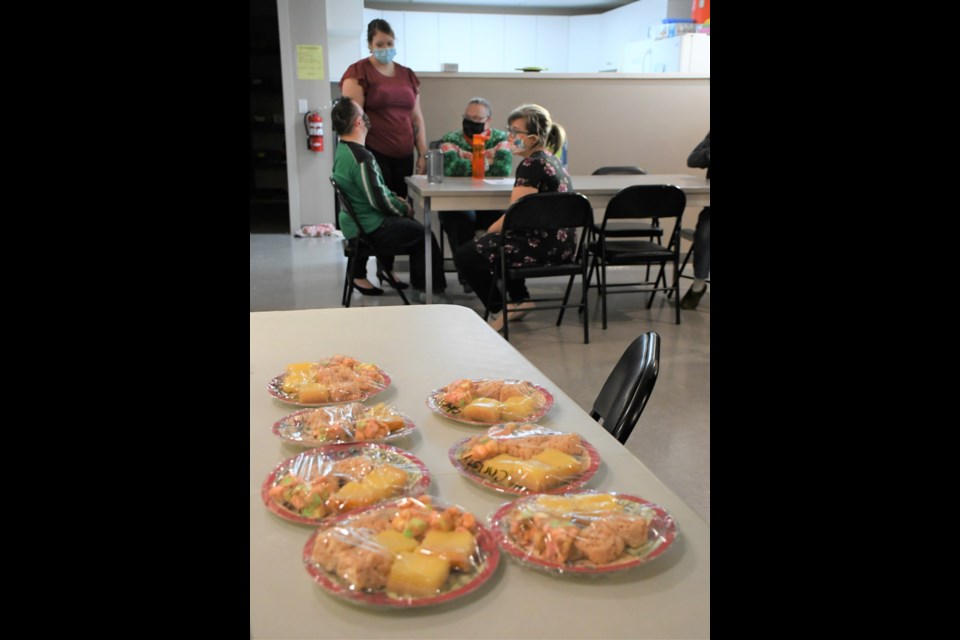 Plates of baked goodies lie on a table waiting to be delivered during a Christmas parade. Photo by Jason G. Antonio 