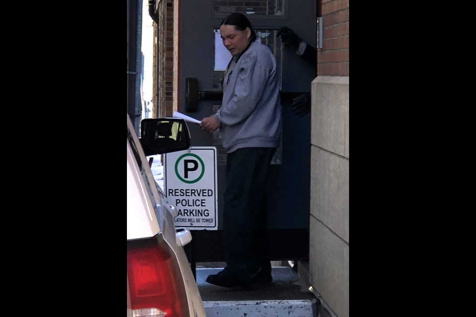 Vincent Picken walks out the back door of Court of King's Bench in Moose Jaw after learning when he would be eligible for parole. Photo by Jason G. Antonio