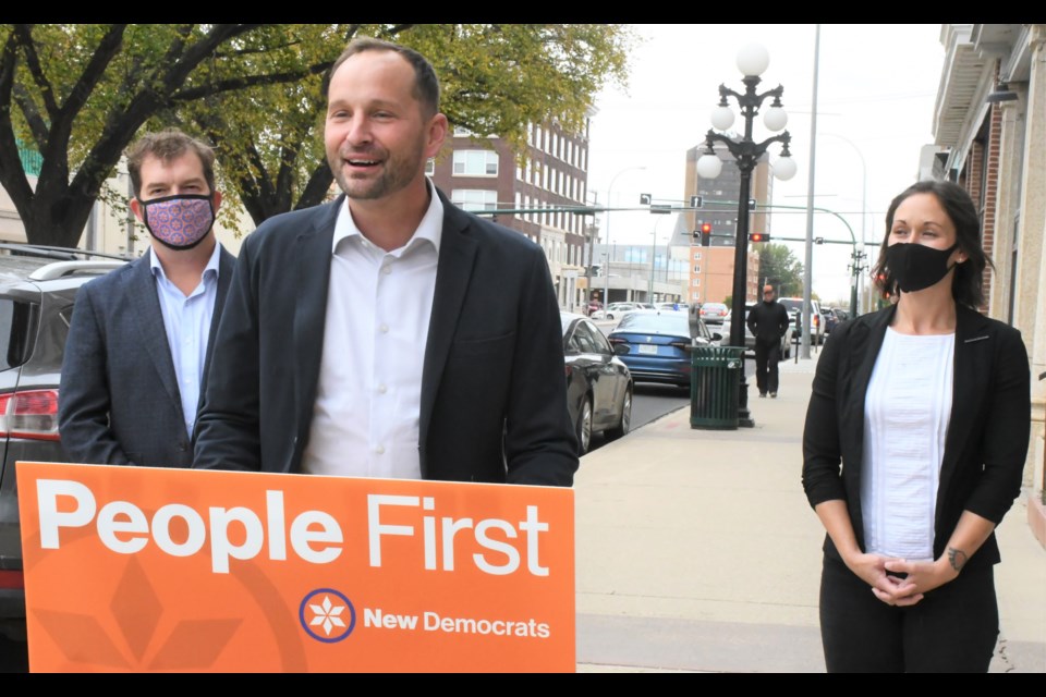 Ryan Meili (centre), leader of the Saskatchewan NDP, speaks during a press conference in Moose Jaw on the first day of the 2020 provincial election campaign. Flanking Meili are Moose Jaw North candidate Kyle Lichtenwald and Moose Jaw Wakamow candidate Melissa Patterson. Photo by Jason G. Antonio 