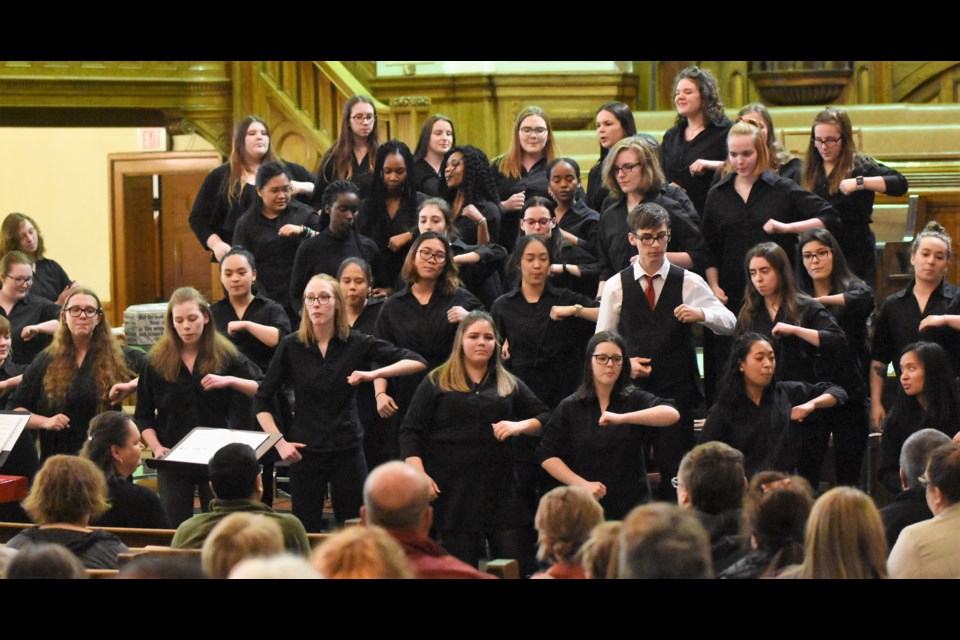 Members of the Vanier Concert Choir dance while singing “Sesere eeye” a song from the Indigenous people of the Torres Strait Islands in Australia at the Moose Jaw Music Festival choral concert at Zion United Church Tuesday. (Matthew Gourlie photograph).