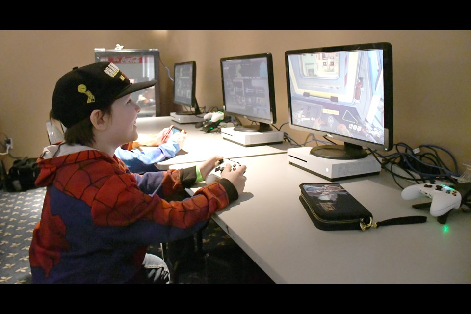 A computer gamer takes part in match of Overwatch during a previous GAX event. File photo 