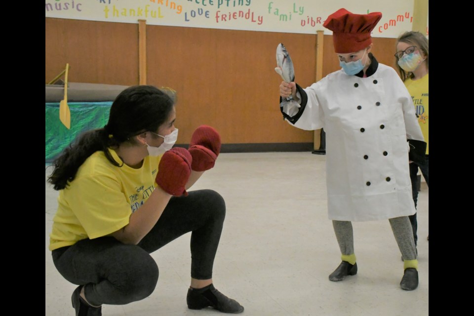 Sebastian the Crab (Sakina Stationwala, left) faces off against Chef Louis (Lexie Watson) while rehearsing. Photo by Jason G. Antonio 