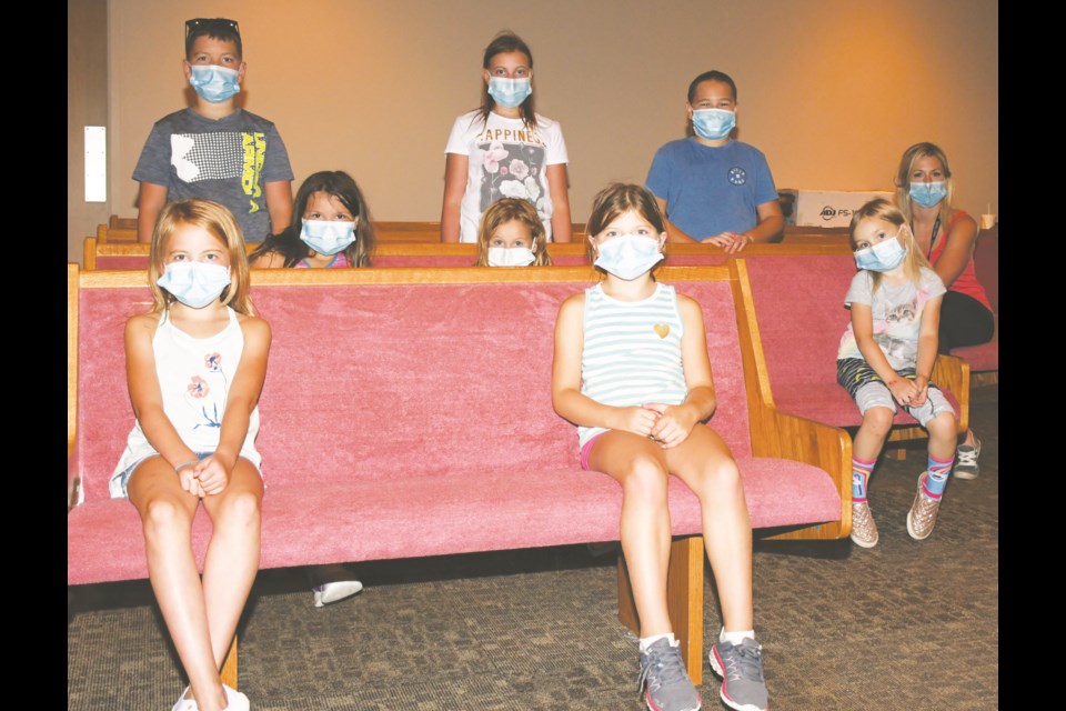 Younger children who participated in a summer drama day camp gather for a picture on Aug. 7. At far right is Jan Nelson, who led the group and helped found the theatre company in which the kids participated. Photo by Jason G. Antonio