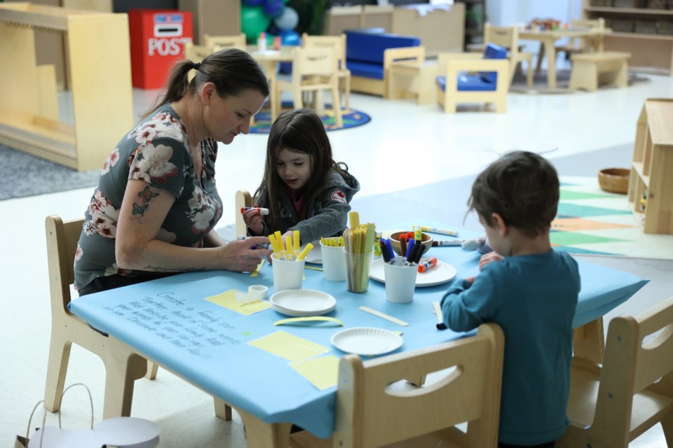 Families are engaged in craft building and colouring which are one of the fun activities hosted by Moose Jaw Early Years Family Resource Centre to celebrate Family Literacy Day