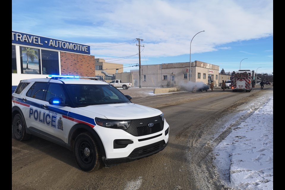 Emergency crews battle what appears to be an engine compartment fire on a light vehicle along Caribou Street West on the afternoon of Jan. 25.