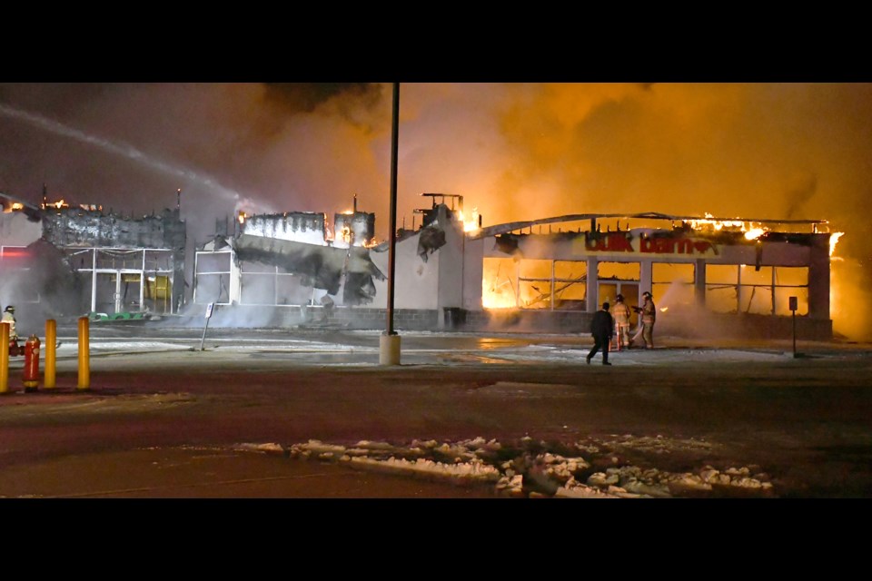 The Moose Jaw Fire Department works to extinguish a massive blaze at the Dollar Tree and Bulk Barn on Thatcher Drive.