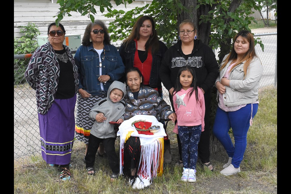 Members of the Black Bull family traveled from Rosebud, S.D. to be part of the restored grave Tasinaskawin headstone unveiling: Barbara Black Bull (back left), Velma Kills Back, Sunrise Black Bull, Ramona Black Bull-Straight, Iwoblu Win Big Crow, Dayvon James Black Bull (front left), elder Lillian Black Bull-Straight, Layla Faye Big Crow.