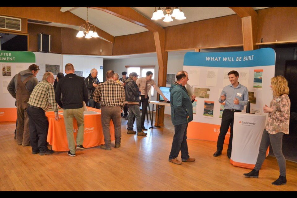 Members of the public talk to representatives from SaskPower at the Southeast Industrial Concept Plan Open House. Matthew Gourlie photograph