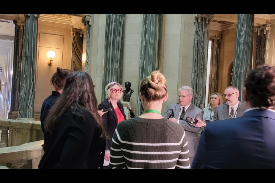 Cheantelle Fisher from the Moose Jaw & District Food Bank speaks to media at the Saskatchewan Legislature