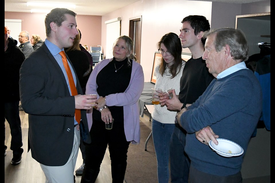 Moose Jaw – Lake Centre – Lanigan NDP candidate Talon Regent chats with supporters during election night, including former Saskatchewan Premier Lorne Calvert.