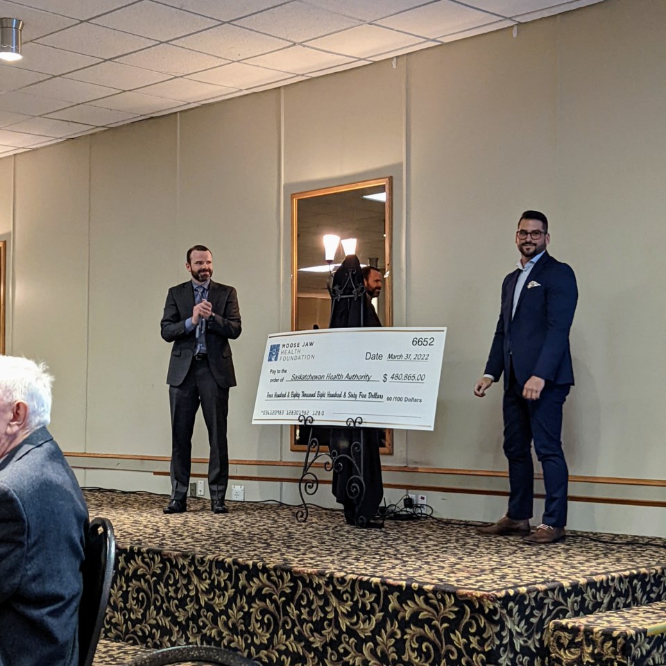 Derek Miller and Ryan Hrechka unveil the big cheque