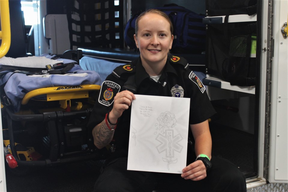 Moose Jaw & District EMS paramedic Aimée Astick, with the piece of artwork she submitted to a recent issue of Canadian Paramedicine.