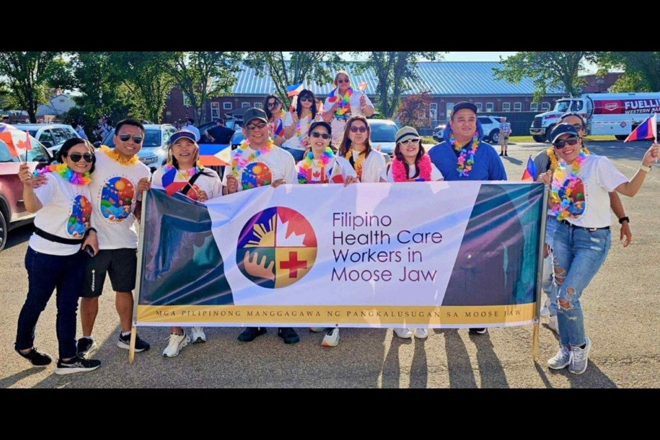 Members of the Filipino Health Care Workers in Moose Jaw gather before the start of the Hometown Fair parade. Photo courtesy Filipino Health Care Workers in Moose Jaw