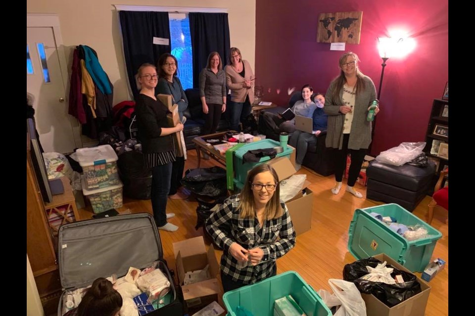 Packing supplies and getting ready. (Facebook photo)