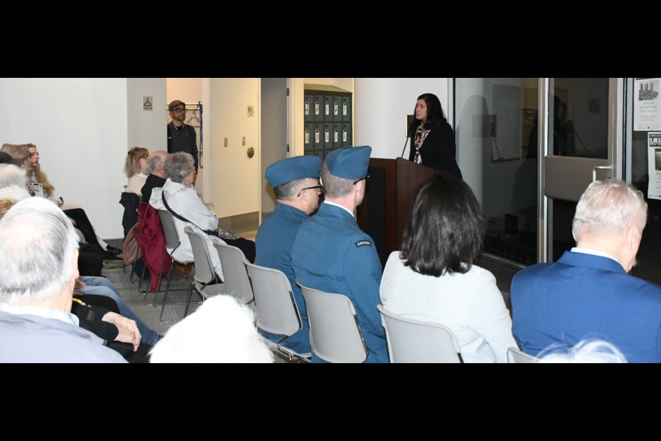 Jennifer McRorie, curator of the museum and art gallery, speaks to the crowd as the event MC. Photo by Jason G. Antonio