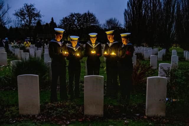 Sea Cadets place candles at Canadian Air Force graves during a candlelit Christmas Remembrance service at the Commonwealth War Graves at Stonefall Cemetery, Harrogate. Photo courtesy Yorkshire Post