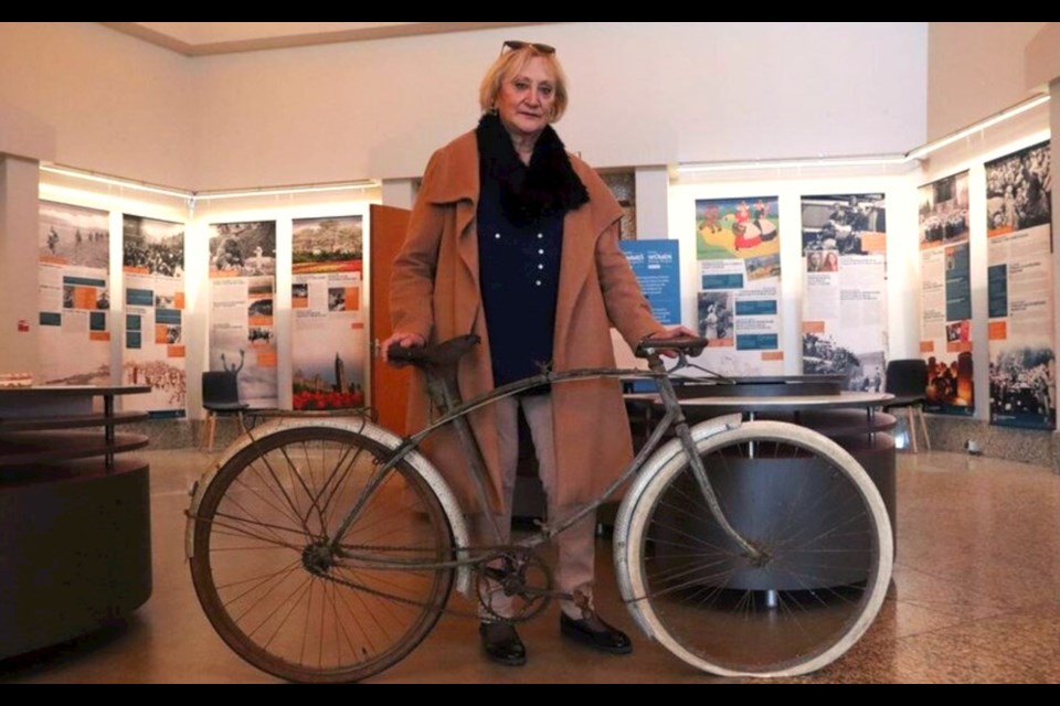 Marie-Claude Halot with the bicycle that was given to her father by a Canadian soldier who landed at Juno Beach in Normandy on D-Day. Photo courtesy Juno Beach Centre