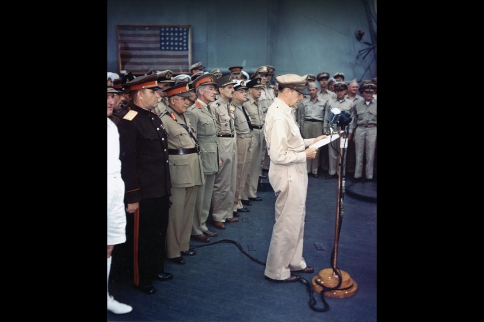 General Douglas MacArthur, Supreme Allied Commander, delivers a speech to open the surrender ceremony aboard USS Missouri. Canadian Col. Lawrence Cosgrave is behind him, third from left, the lowest-ranking Allied officer to sign the surrender documents. Photo courtesy Legion Magazine