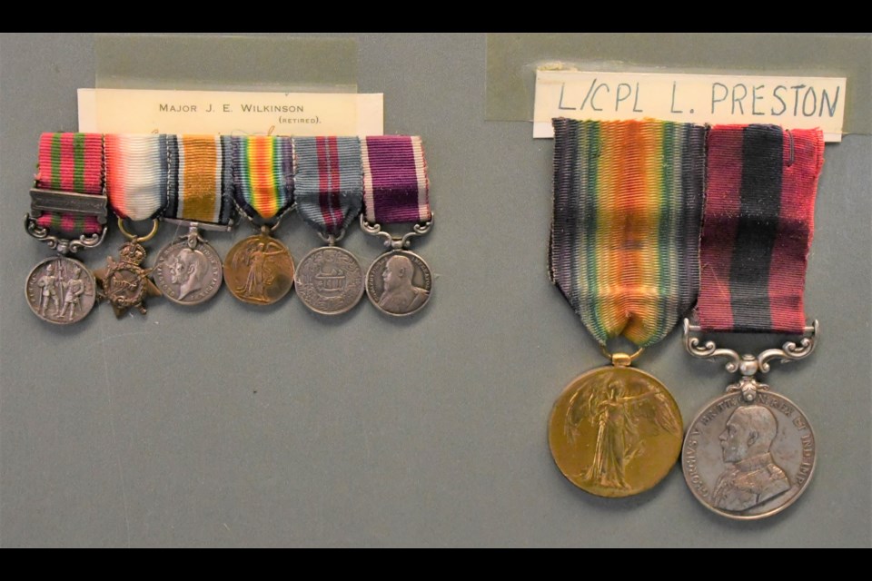 Veterans’ medals hang from a piece of cardboard, just some of the items found during the cleanout of the third floor of the legion building. The medals at left belonged to Major J. E. Wilkinson and the medals at right belonged to Lance Cpl. Lewis Preston. Preston was born in Yorkshire, England and died of his wounds on Sept. 11, 1917. Photo by Jason G. Antonio