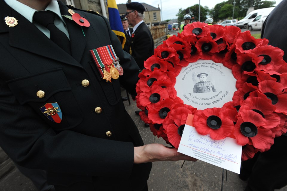 Major Alison Lucas, with the Canadian Army, holds a wreath that honours Moose Jaw soldier Pte. William Johnstone Milne. Photo courtesy Stuart Vance, Wishaw Press, Scotland
