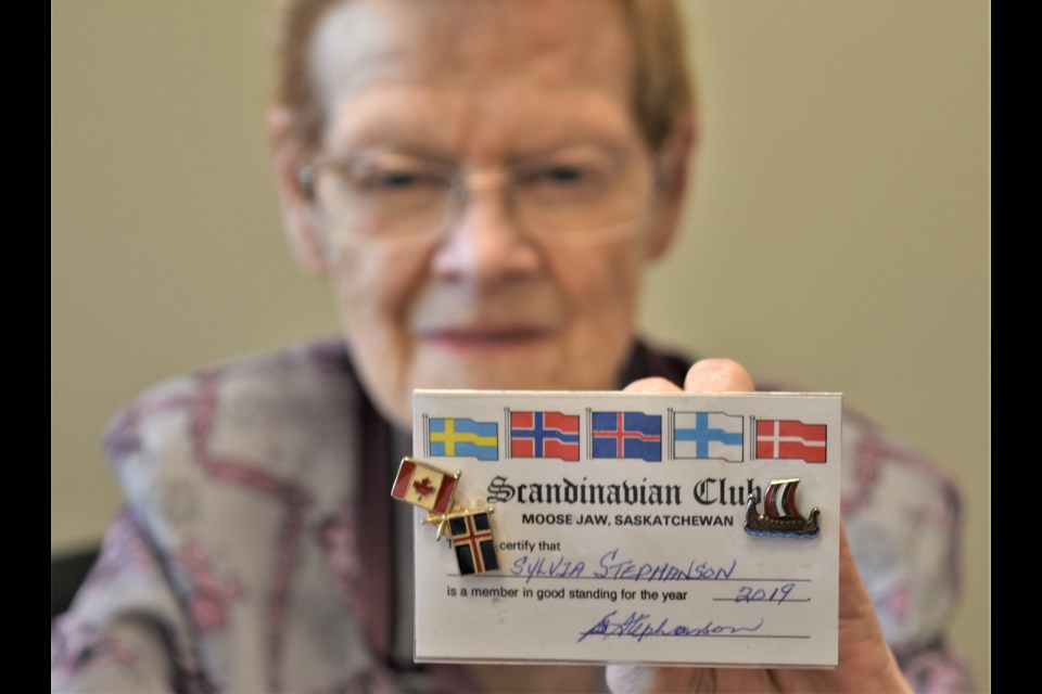 Sylvia Stephanson, president of the Scandinavian Club, displays her membership card. Photo by Jason G. Antonio 