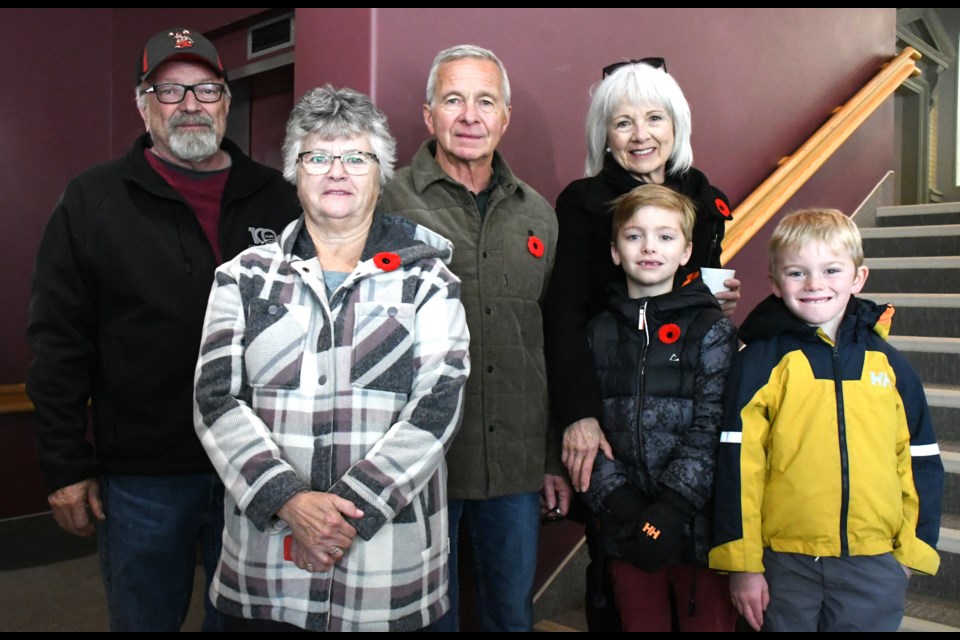 Some members of the James Burleigh Hill family gather for a picture after the ceremony. From left are nephew Brian Hill, niece Marilyn Tighe, nephew (Calvin) Burleigh Hill, niece Chris Hill, great-great-nephew Finn Olfert and great-great-nephew Burleigh Kempe. Photo by Jason G. Antonio