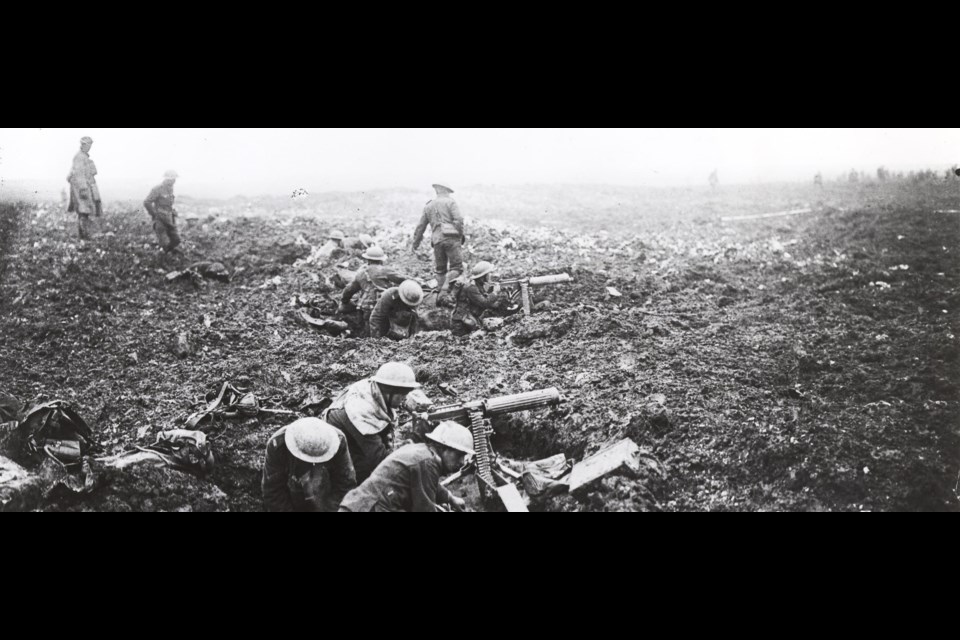 Soldiers with machine guns prepare to support the assault. Photo courtesy UWaterloo