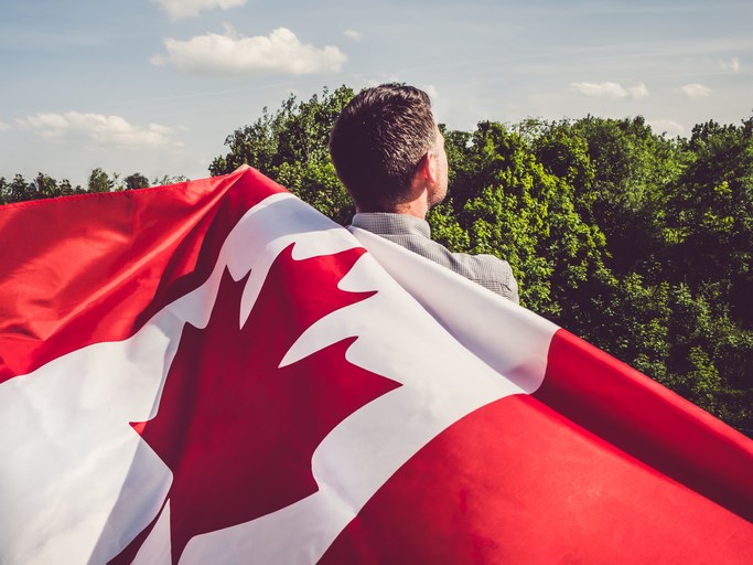 canada day man with flag getty images