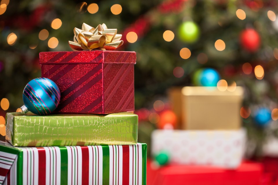 christmas gifts under tree shutterstock