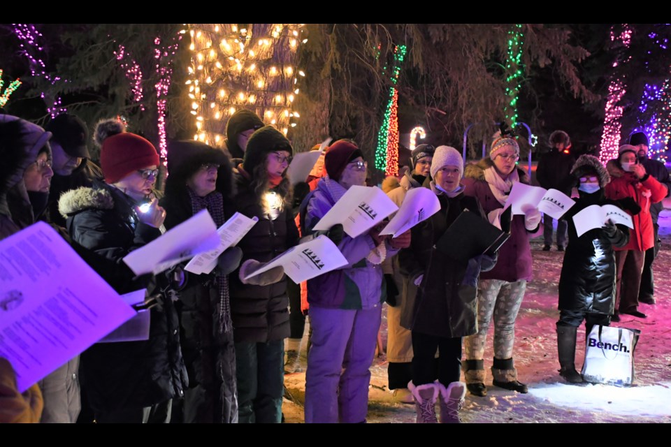 Members of the Moose Jaw Community Choir sing Christmas tunes in Wakamow Valley during the Valley of Lights tour. Photo by Jason G. Antonio 